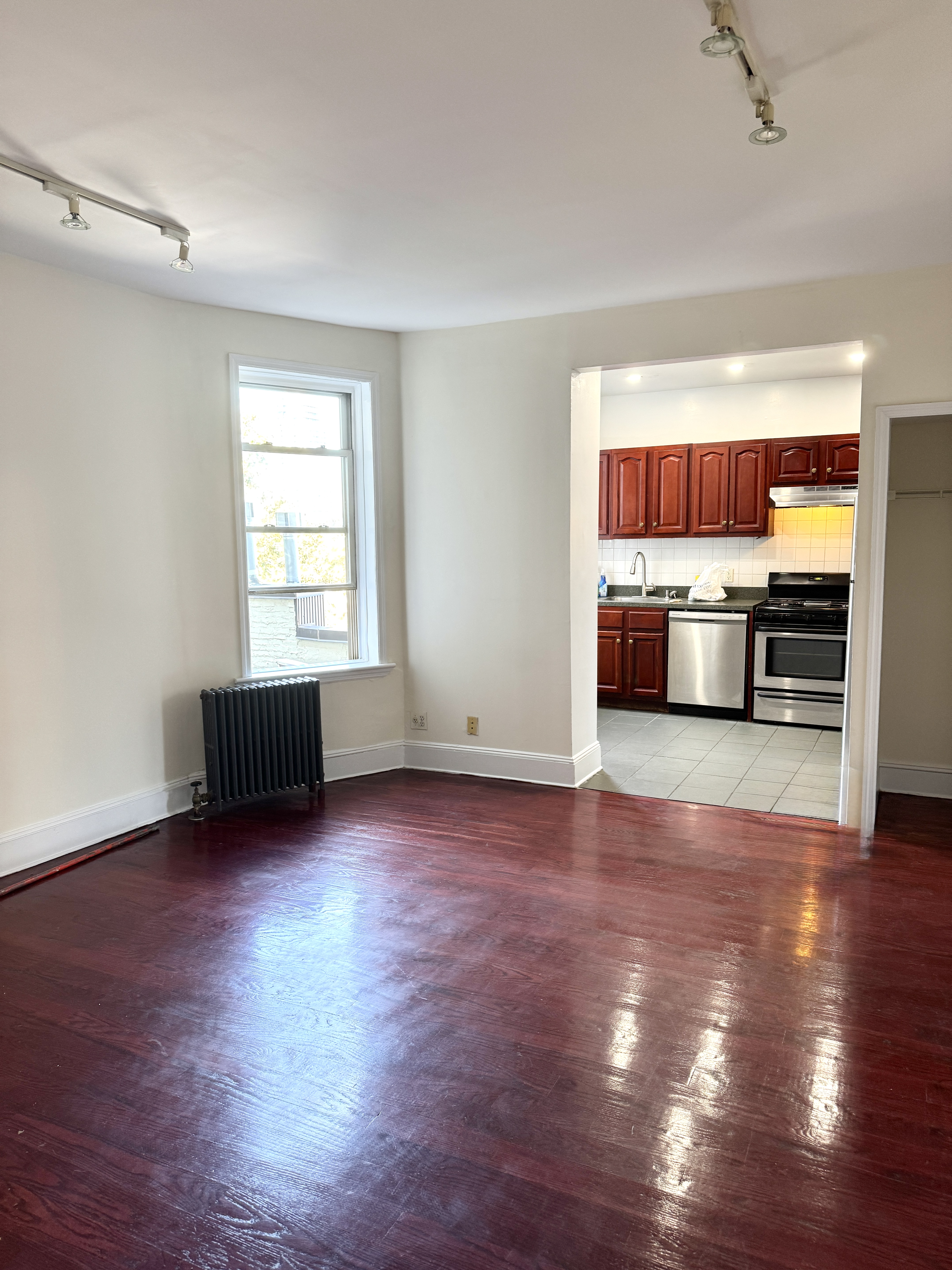 260 Cumberland Street, Unit 21 Brooklyn, NY 11205 - Photo 2 of 13 a view of kitchen and empty room with wooden floor