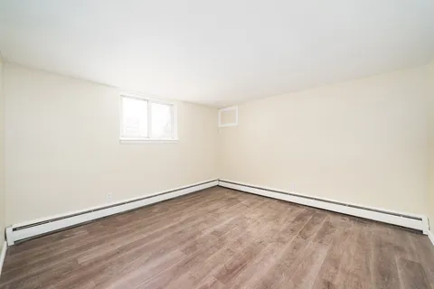 an empty room with a empty space and window