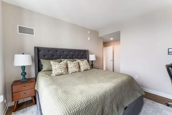 a spacious bathroom with a double vanity sink mirror and toilet