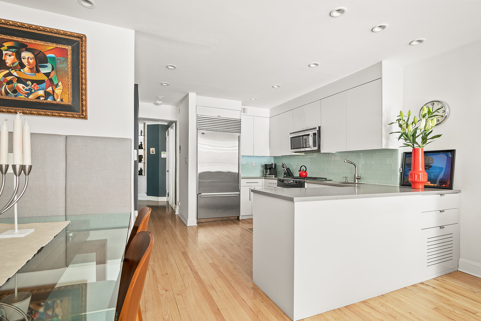 24 West 70th Street, Unit 1 Manhattan, NY 10023 - Photo 7 of 11 a kitchen with stainless steel appliances granite countertop a refrigerator and a stove top oven