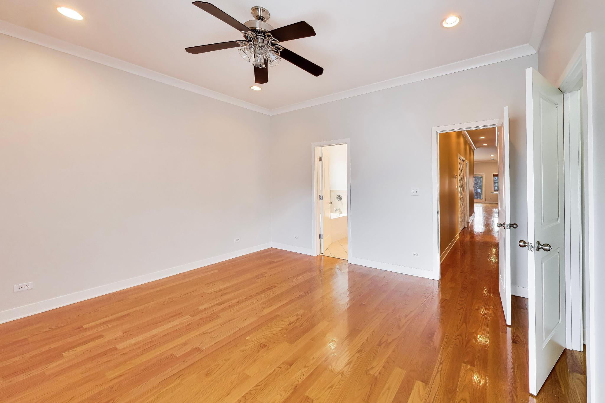 4845 North Springfield Avenue, Unit 2 Chicago, IL 60625 - Photo 25 of 32 wooden floor in an empty room