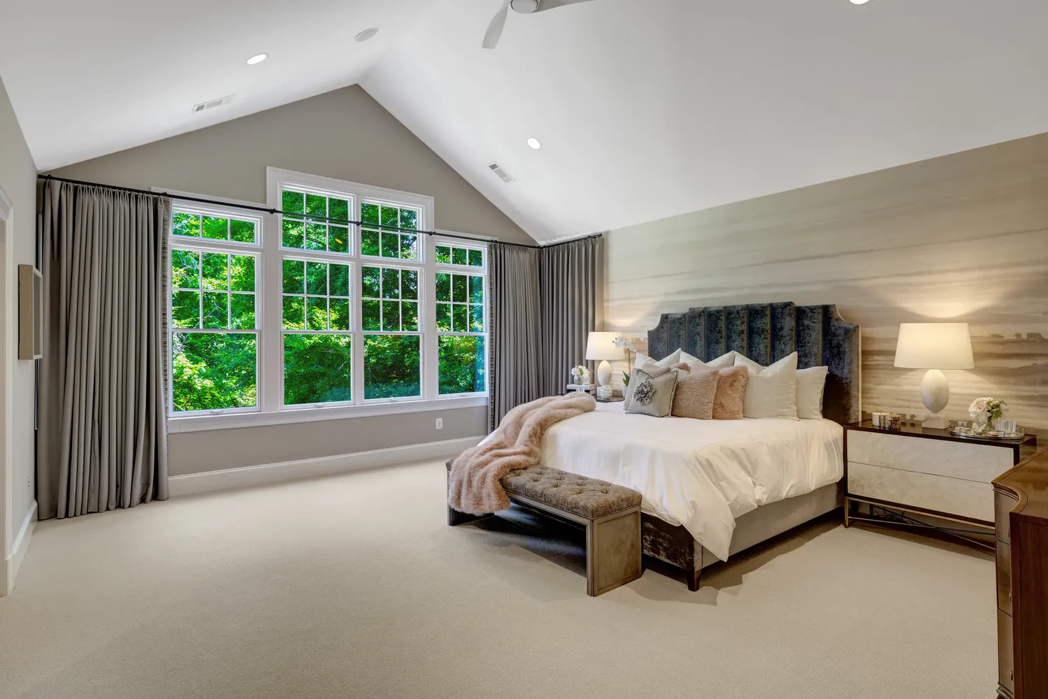 a bedroom with a bed and a lamp