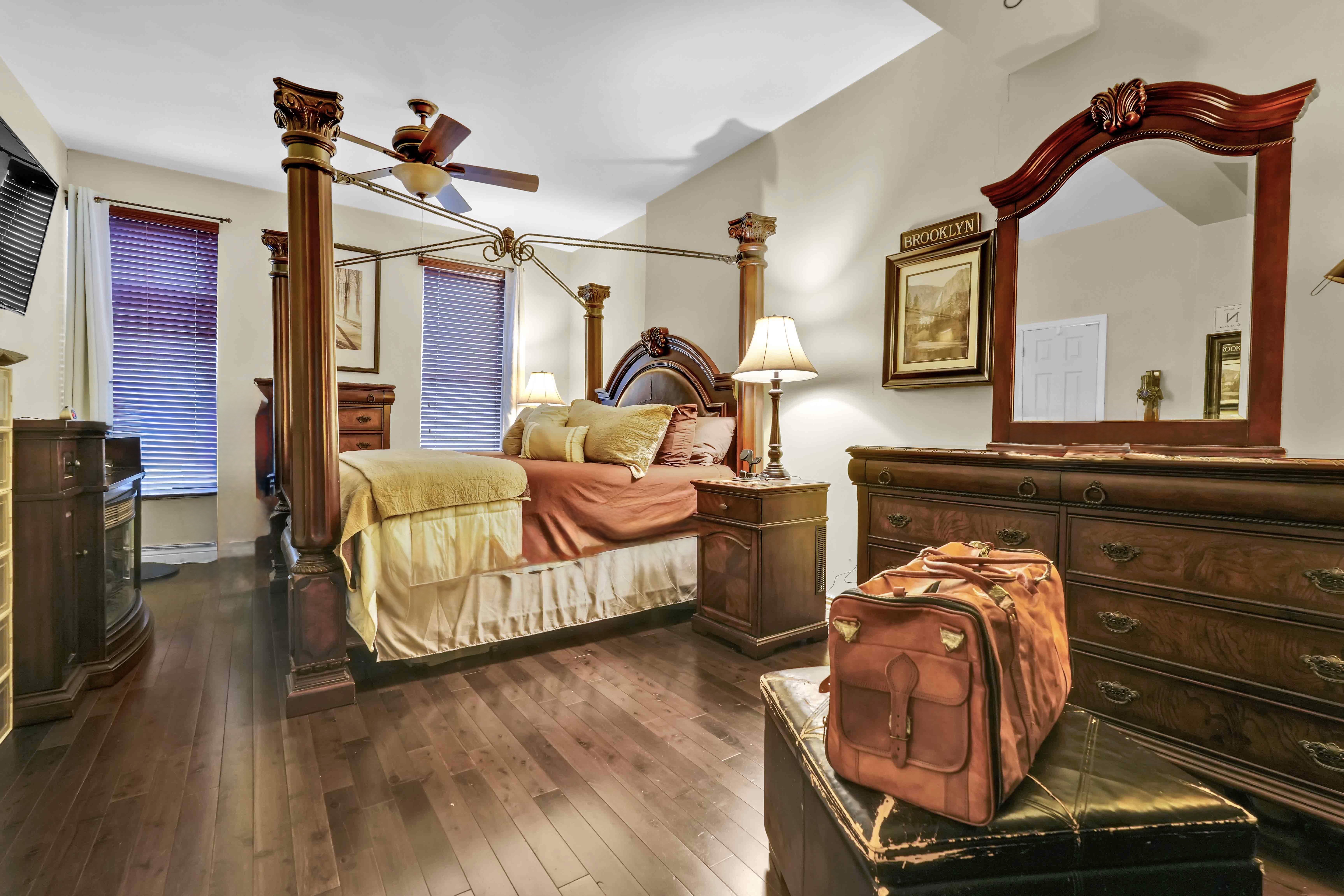 519 Monroe Street Brooklyn, NY 11221 - Photo 43 of 55 a bedroom with furniture and a mirror