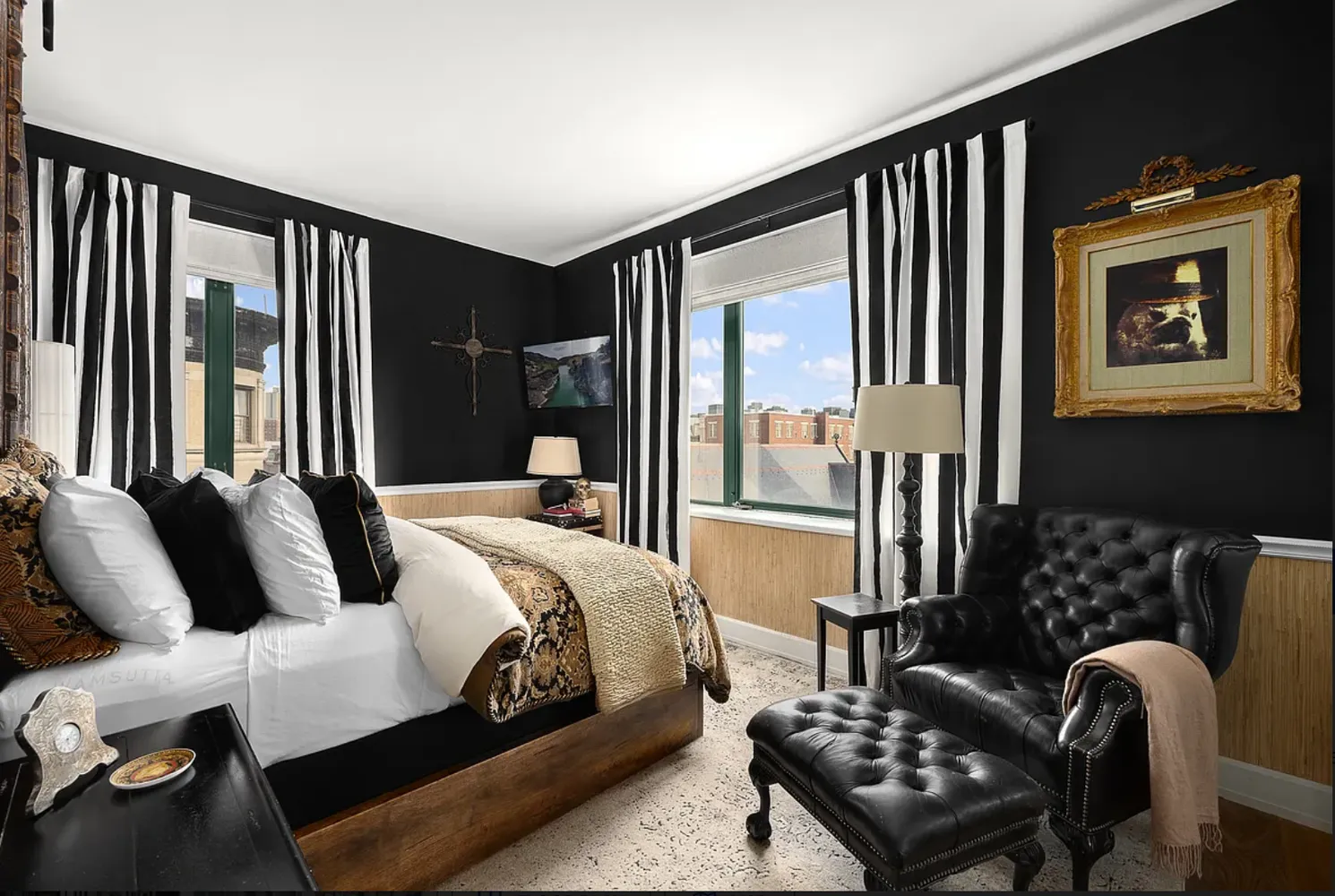 a bedroom with furniture and a window