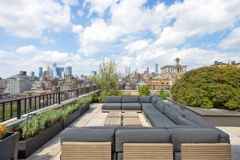a view of a balcony with city view