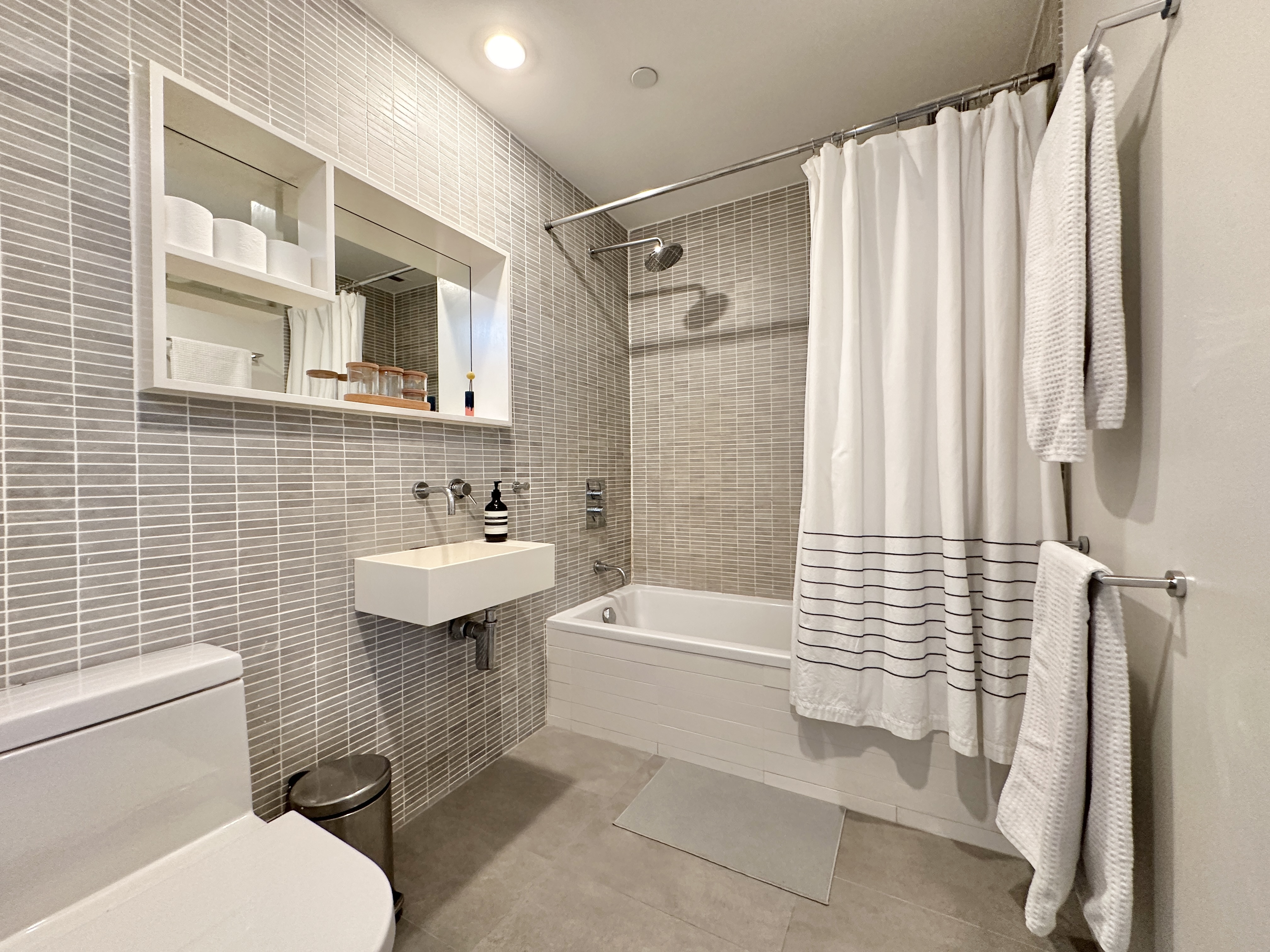 100 North 3rd Street, Unit 3E Brooklyn, NY 11249 - Photo 10 of 15 a bathroom with a sink toilet and shower