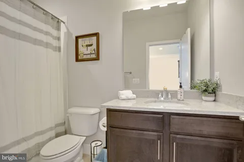 a view of a terrace with a chair and a fireplace