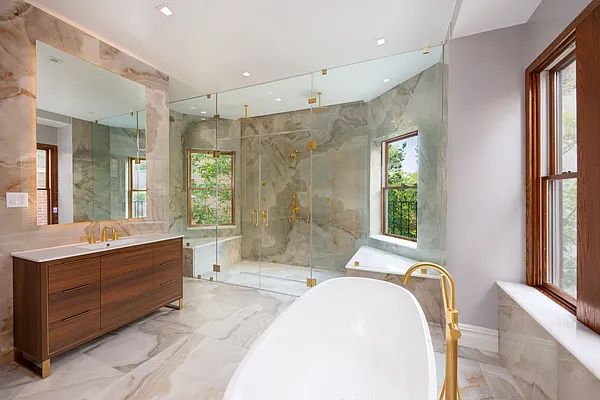 32 Prospect Park West Brooklyn, NY 11215 - Photo 14 of 21 a spacious bathroom with a tub sink shower and mirror