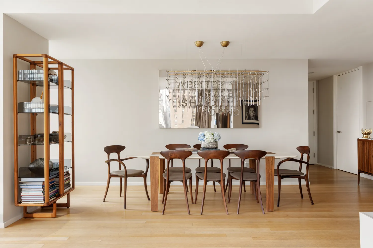 a view of a a dining room with furniture window and wooden floor