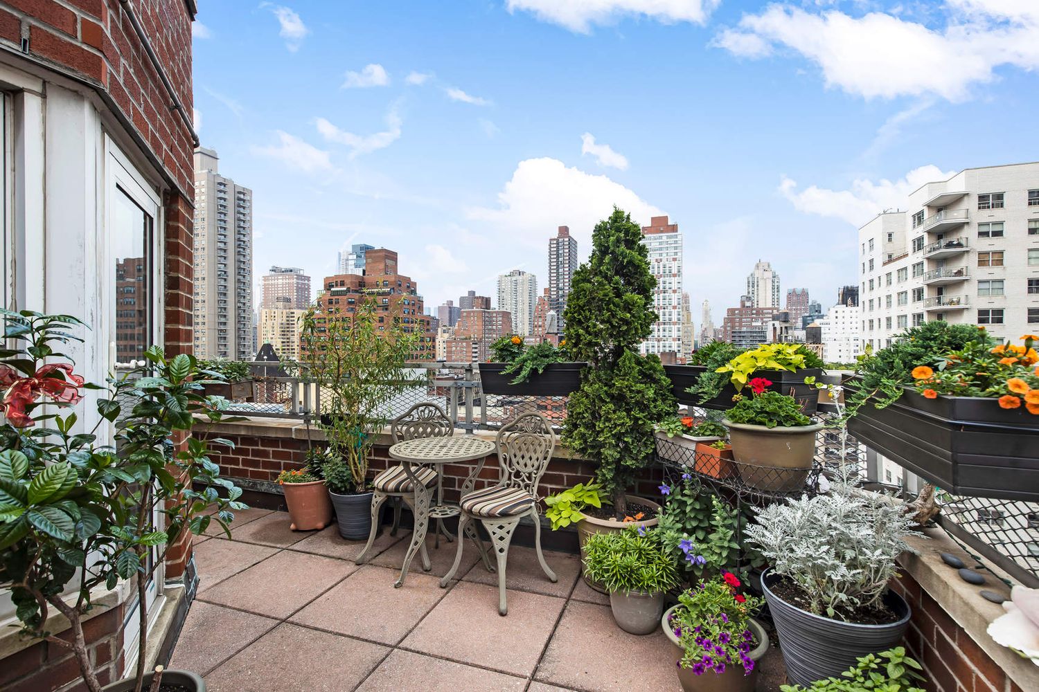 a view of a terrace with sitting area