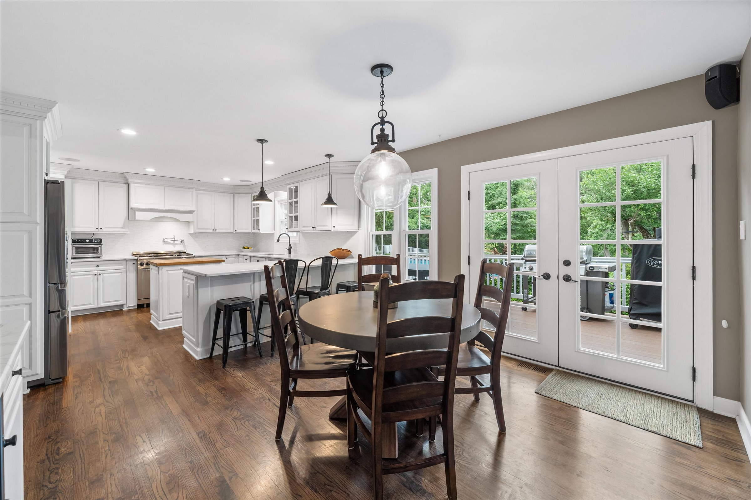 Address Upon Request West Chester, PA 19382 - Photo 12 of 76 a view of a dining room and livingroom with furniture wooden floor a rug and a chandelier