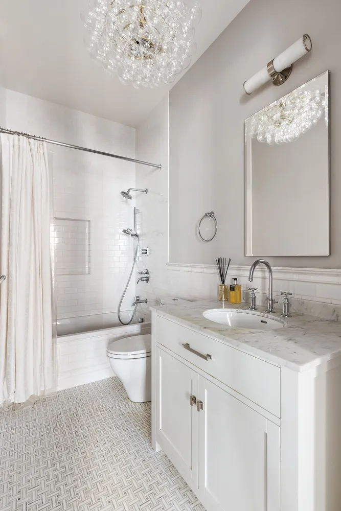 a bedroom with bed and a large window