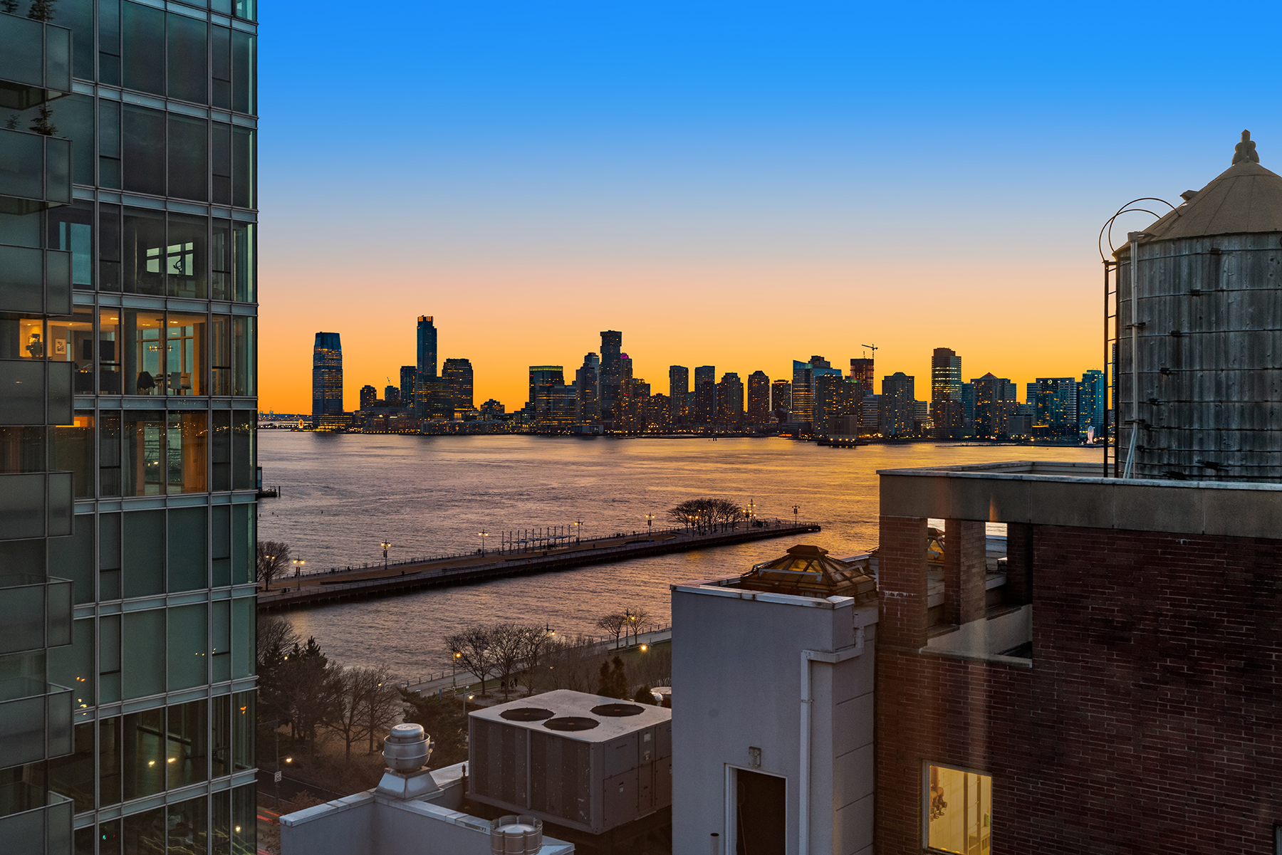 366 West 11th Street, Unit PHF Manhattan, NY 10014 - Photo 7 of 28 a view of a balcony with wooden floor and city view