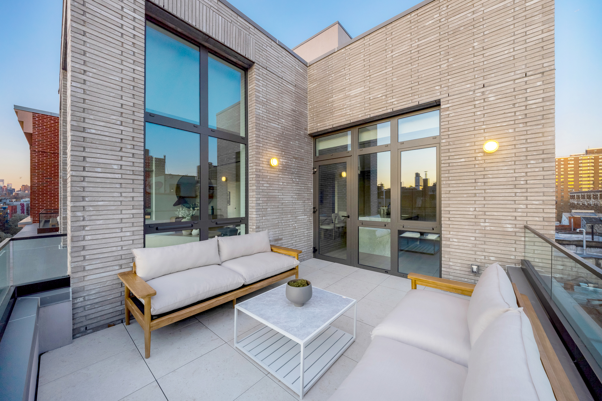 66 Clinton Street, Unit PH Manhattan, NY 10002 - Photo 10 of 20 a patio with patio couch and outdoor view