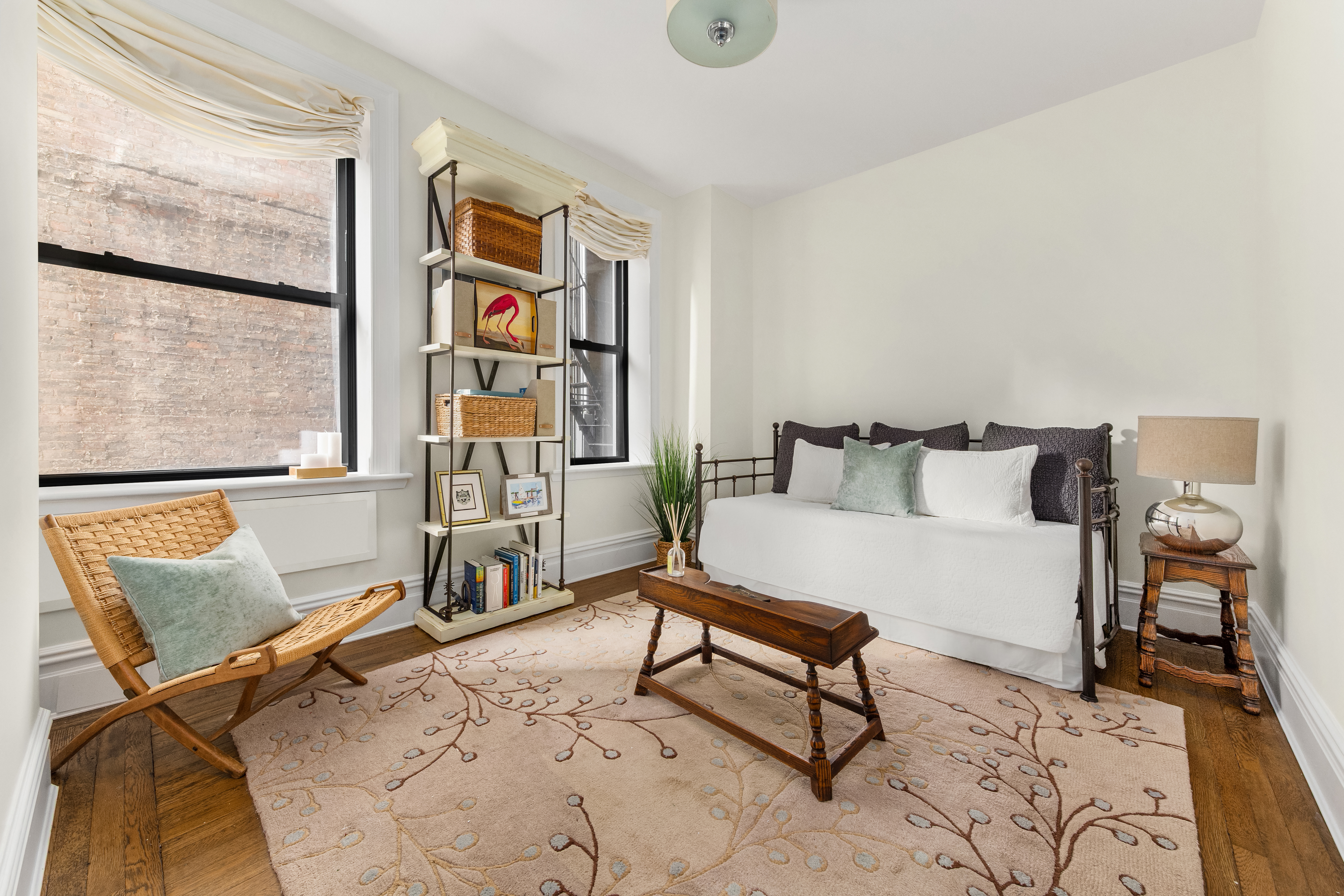 929 Park Avenue, Unit 6C Manhattan, NY 10028 - Photo 5 of 10 a bedroom with furniture and a window