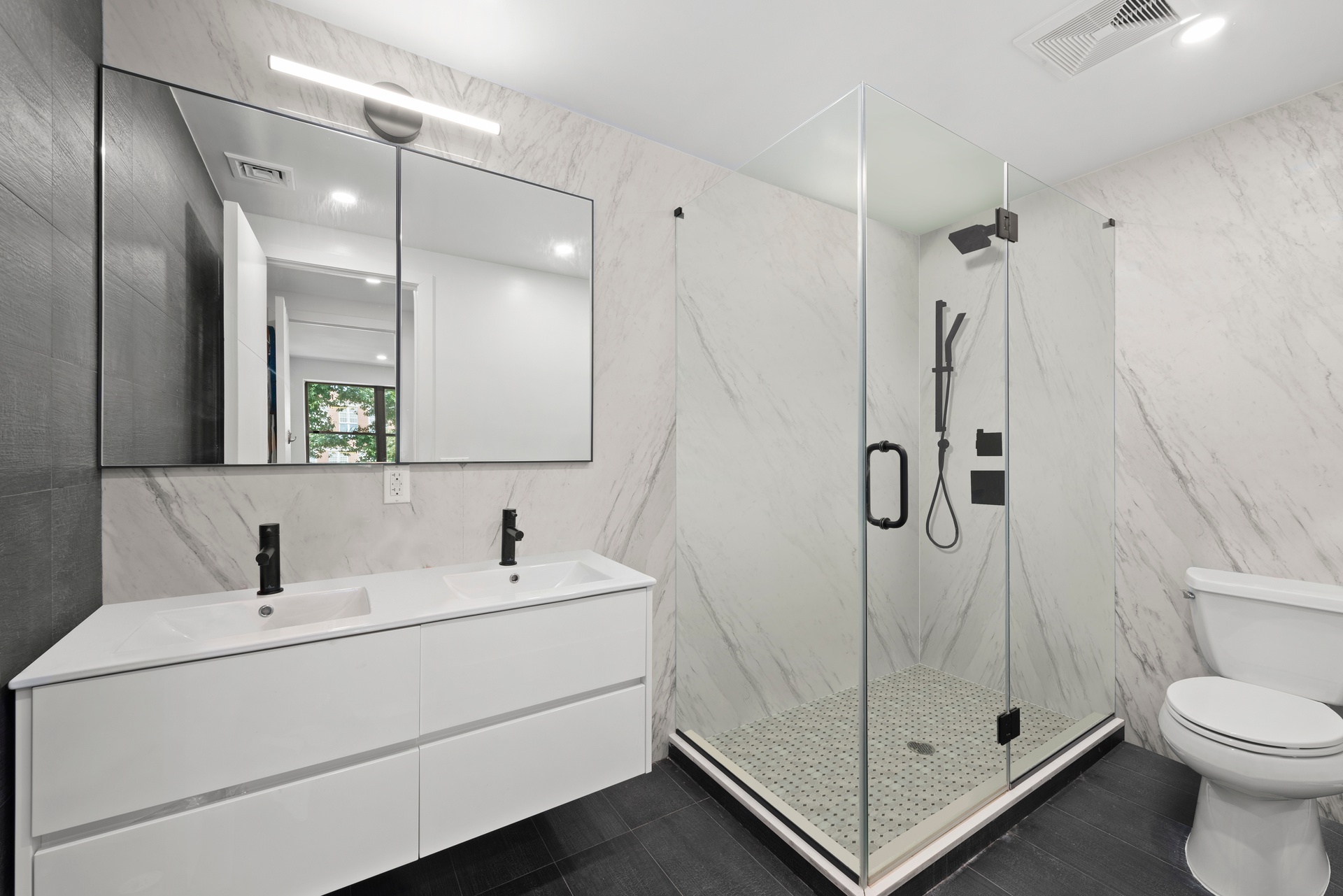 65 Bainbridge Street Brooklyn, NY 11233 - Photo 18 of 24 a bathroom with a sink a toilet and shower