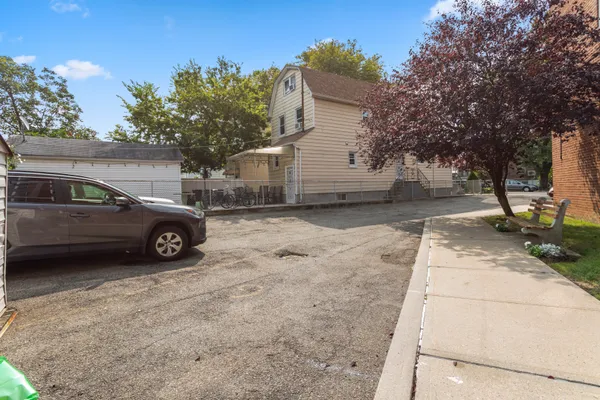 a view of a car parked in front of a house