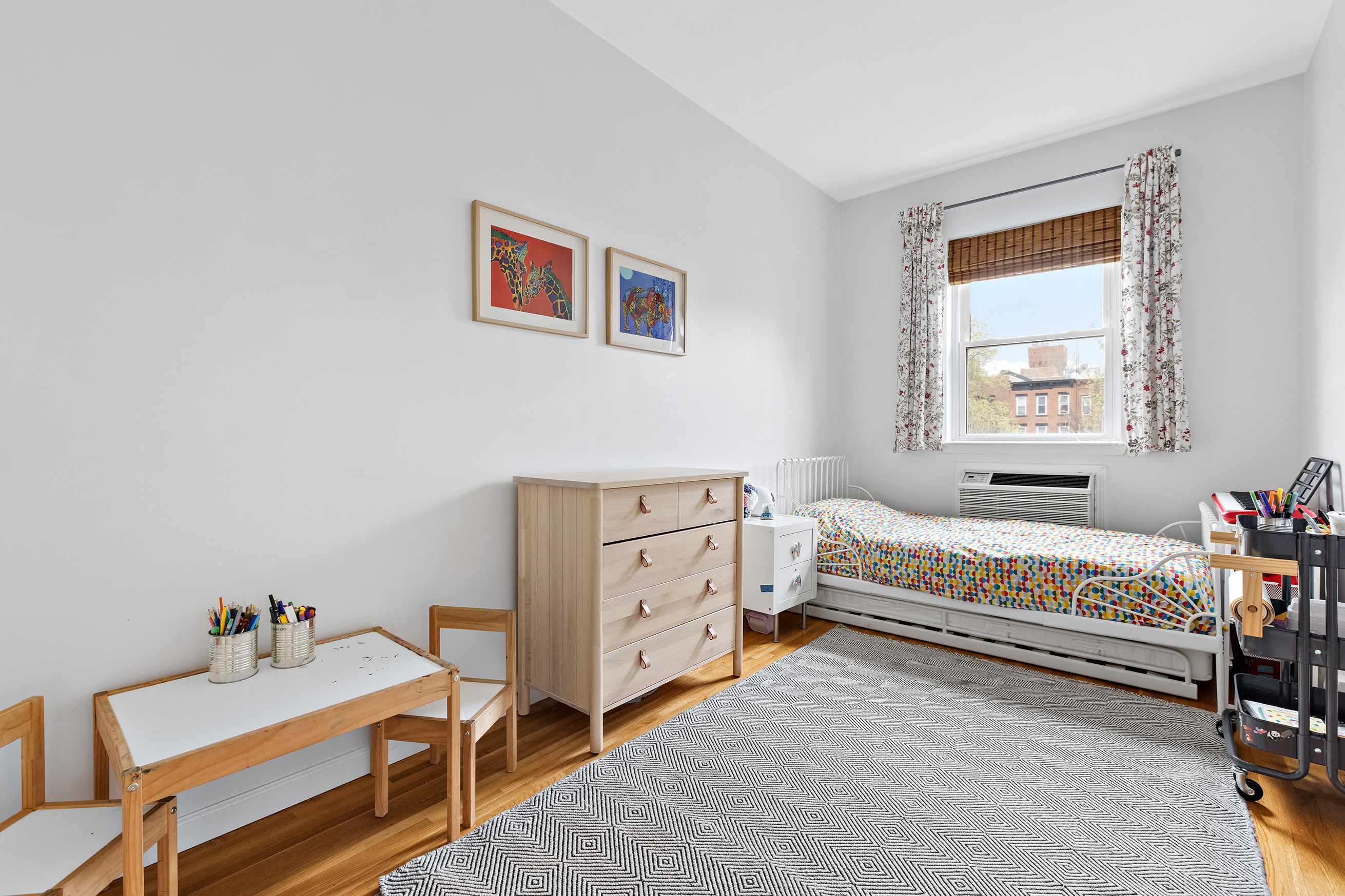 454 12th Street, Unit 3 Brooklyn, NY 11215 - Photo 8 of 18 a bedroom with a bed and a window