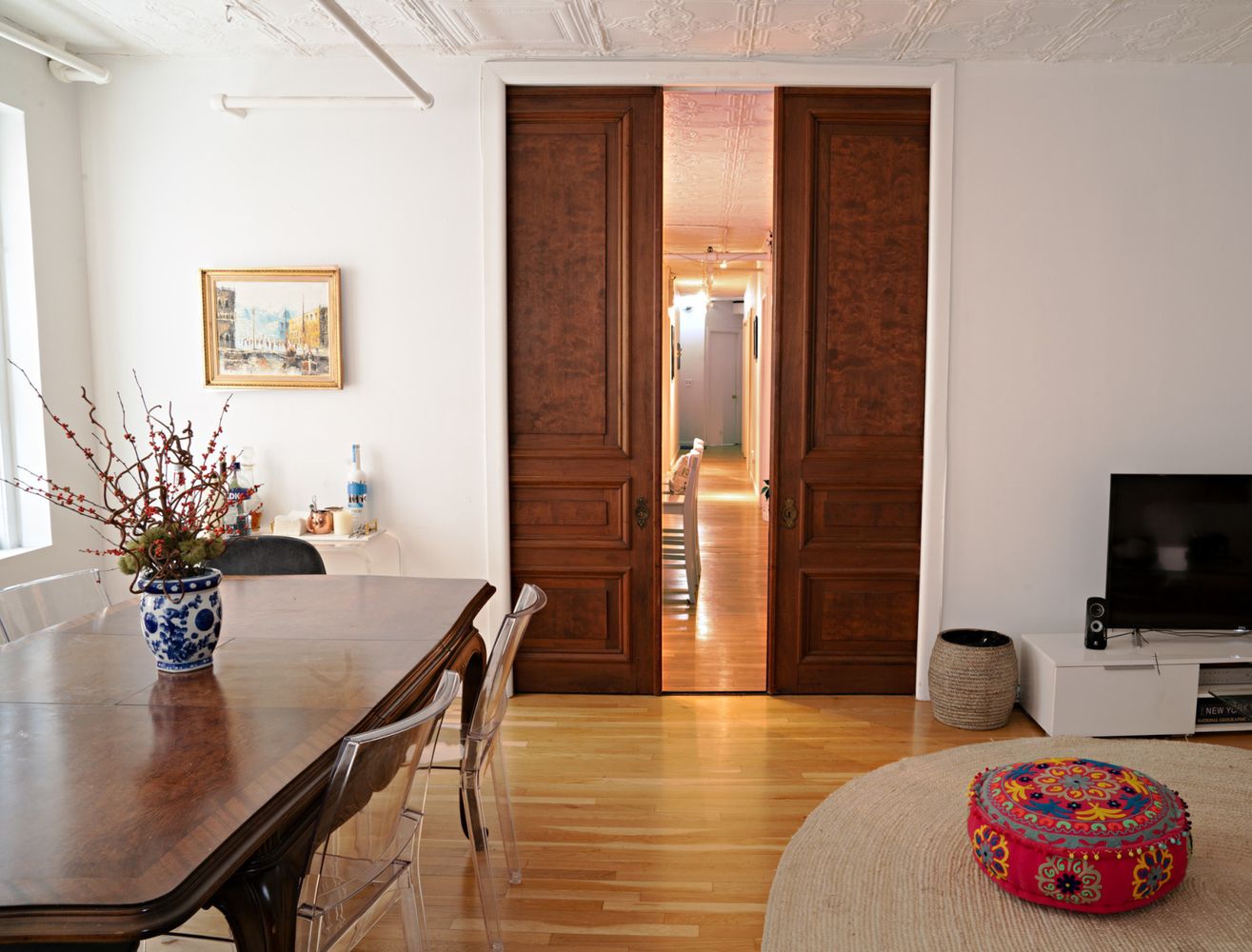 a living room with furniture and a flat screen tv