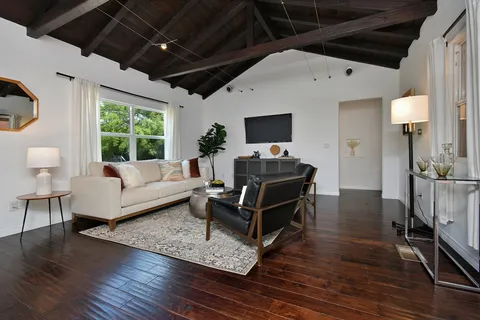 a living room with furniture and a rug