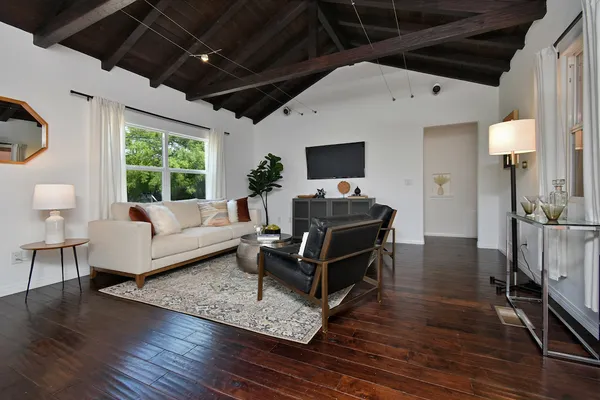 a living room with furniture and a rug