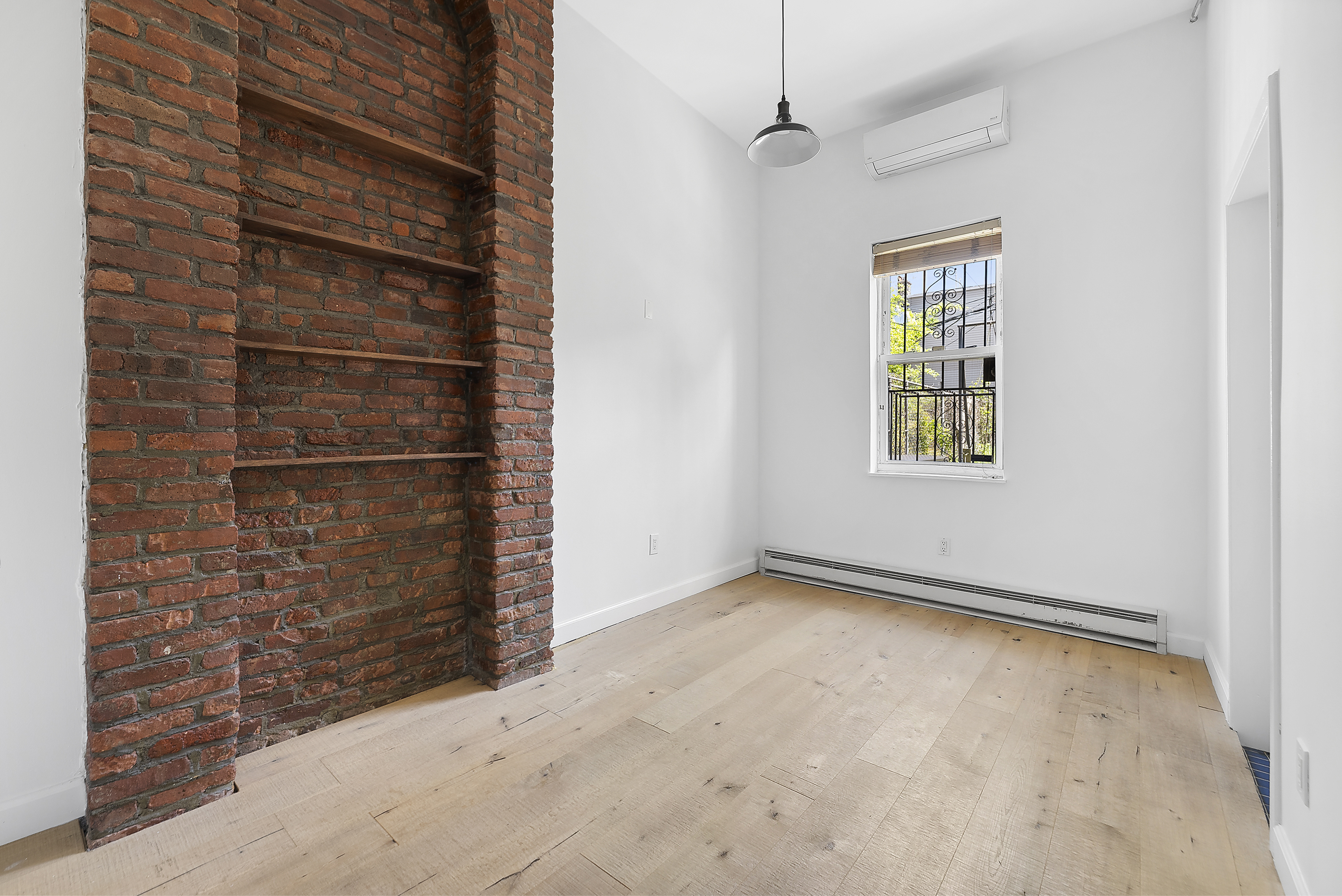 768 Hart Street, Unit 1 Brooklyn, NY 11237 - Photo 10 of 18 a view of an empty room with a window