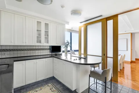 a utility room with sink dryer and washer