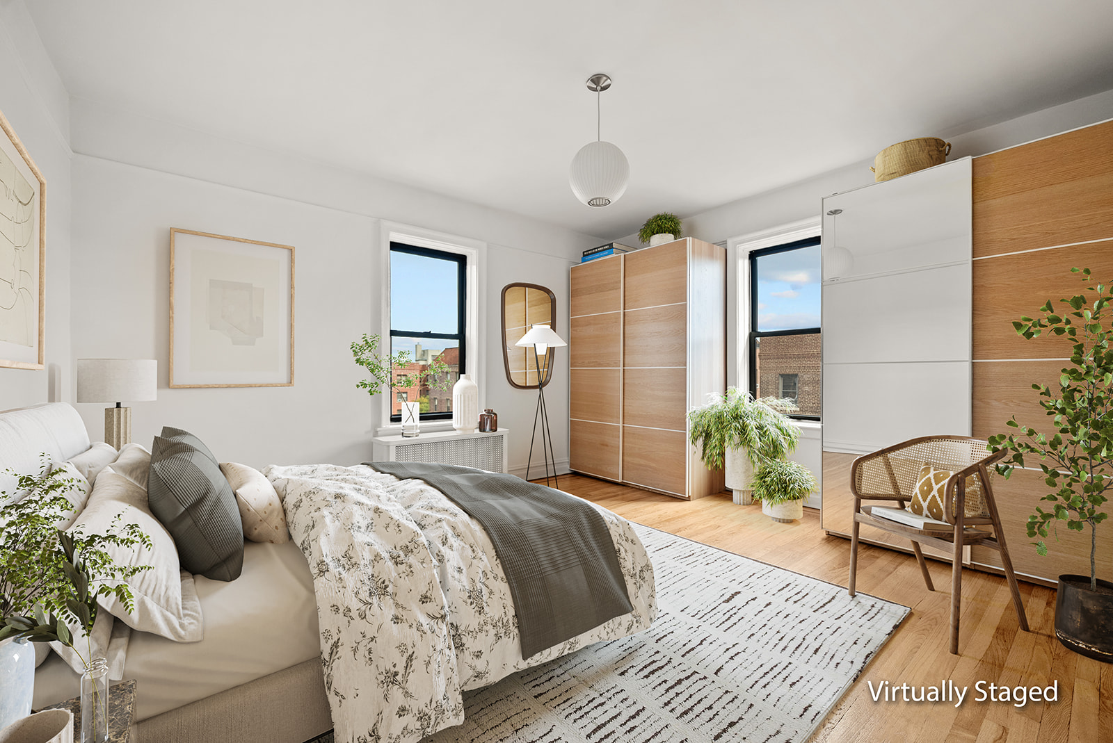 83-10 35th Avenue, Unit 6C Queens, NY 11372 - Photo 5 of 13 a bedroom with a large bed and a rug