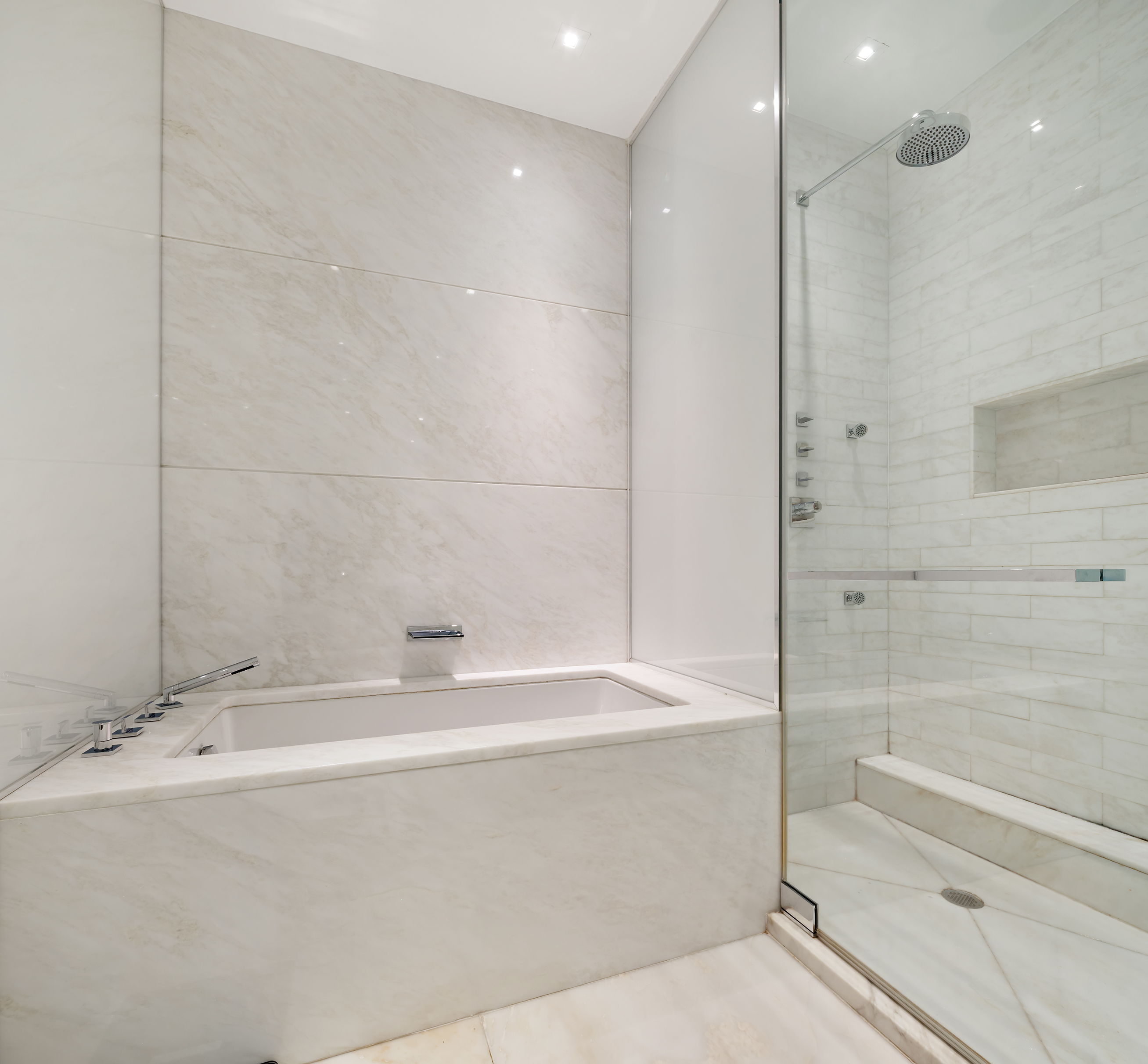 1055 Park Avenue, Unit 1 Manhattan, NY 10028 - Photo 13 of 19 a bathroom with a bathtub and a shower