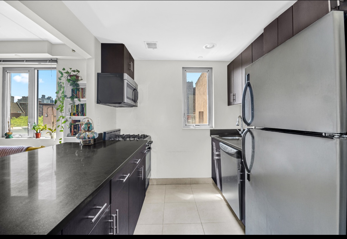 1810 3rd Avenue, Unit A7D Manhattan, NY 10029 - Photo 4 of 13 a kitchen with a sink appliances and cabinets