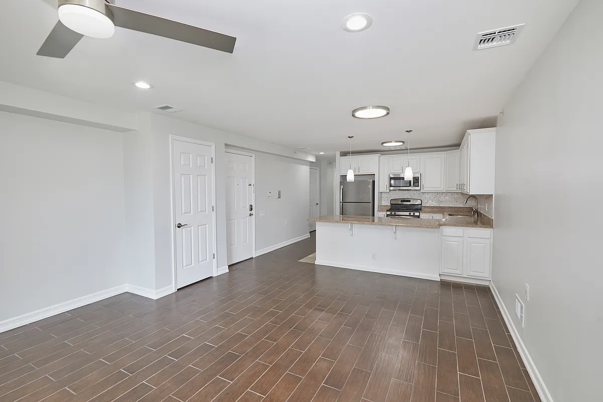a view of kitchen with center island and stainless steel appliances