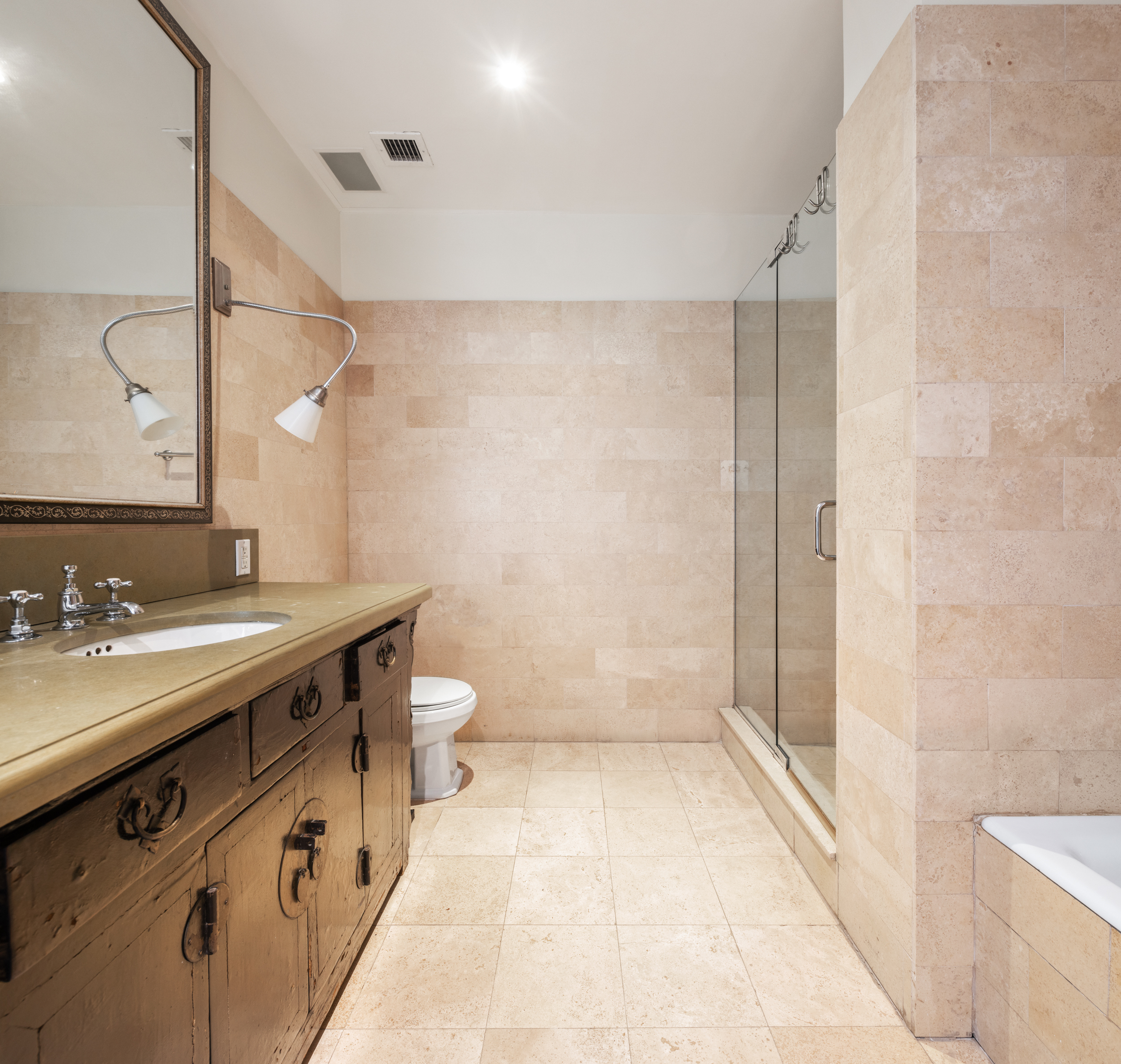 62 Beach Street, Unit 5E Manhattan, NY 10013 - Photo 10 of 15 a bathroom with a double vanity sink toilet and shower