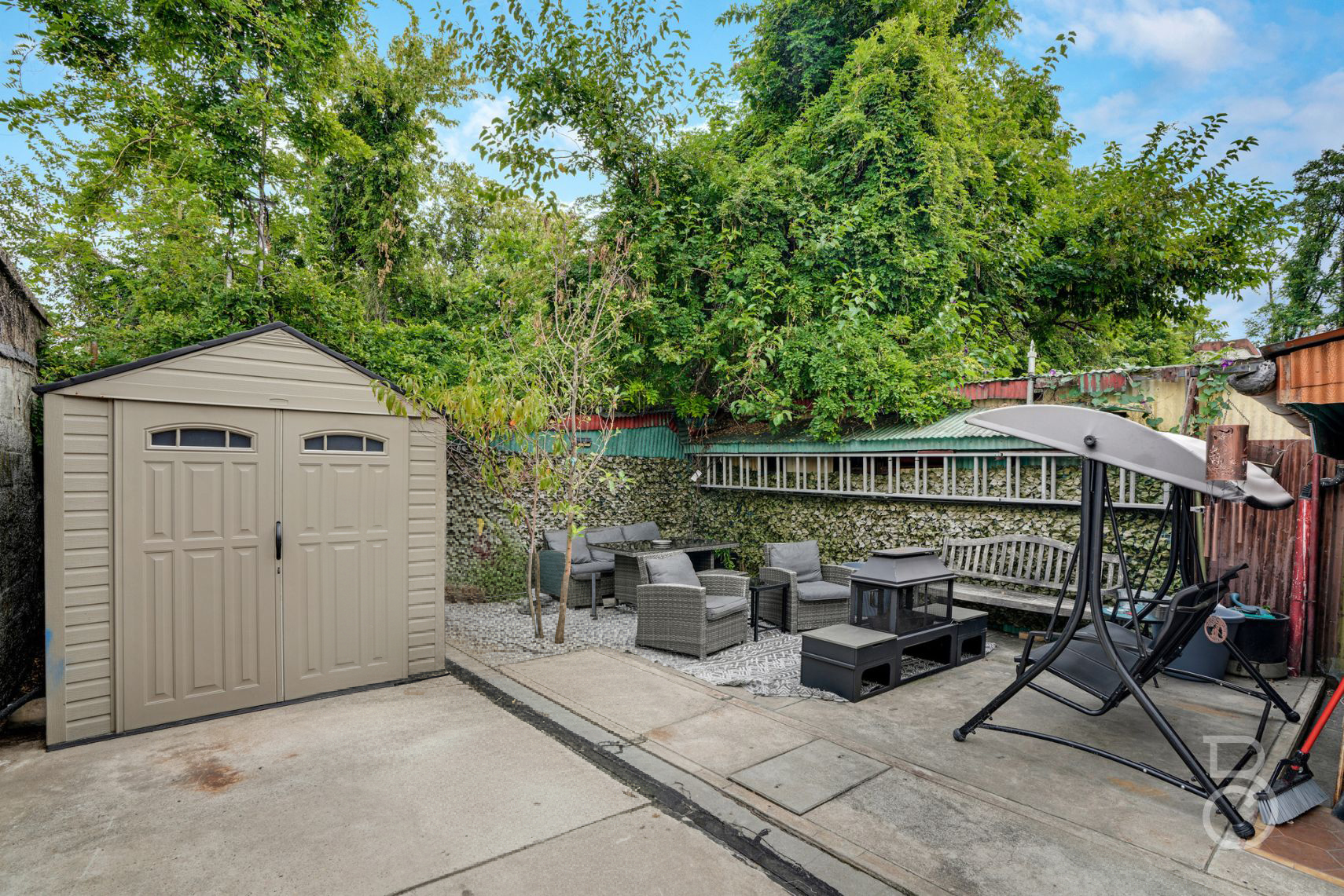 37-09 20th Road Queens, NY 11105 - Photo 16 of 16 a roof deck with table and chairs and potted plants