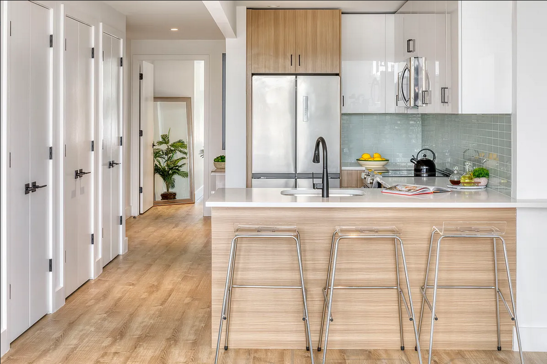 1425 Fulton Street, Unit 4A Brooklyn, NY 11216 - Photo 2 of 12 a kitchen with stainless steel appliances a sink a refrigerator and a window