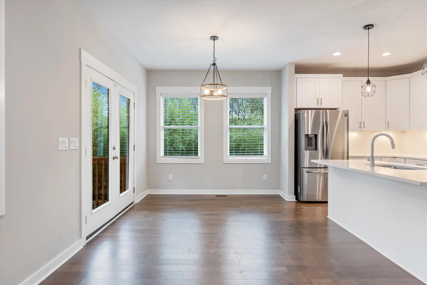 a view of a kitchen with a stove wooden floor and a window