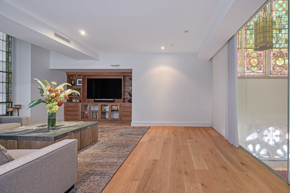 135 West 4th Street, Unit 3E Manhattan, NY 10012 - Photo 5 of 11 a living room with furniture and a flat screen tv