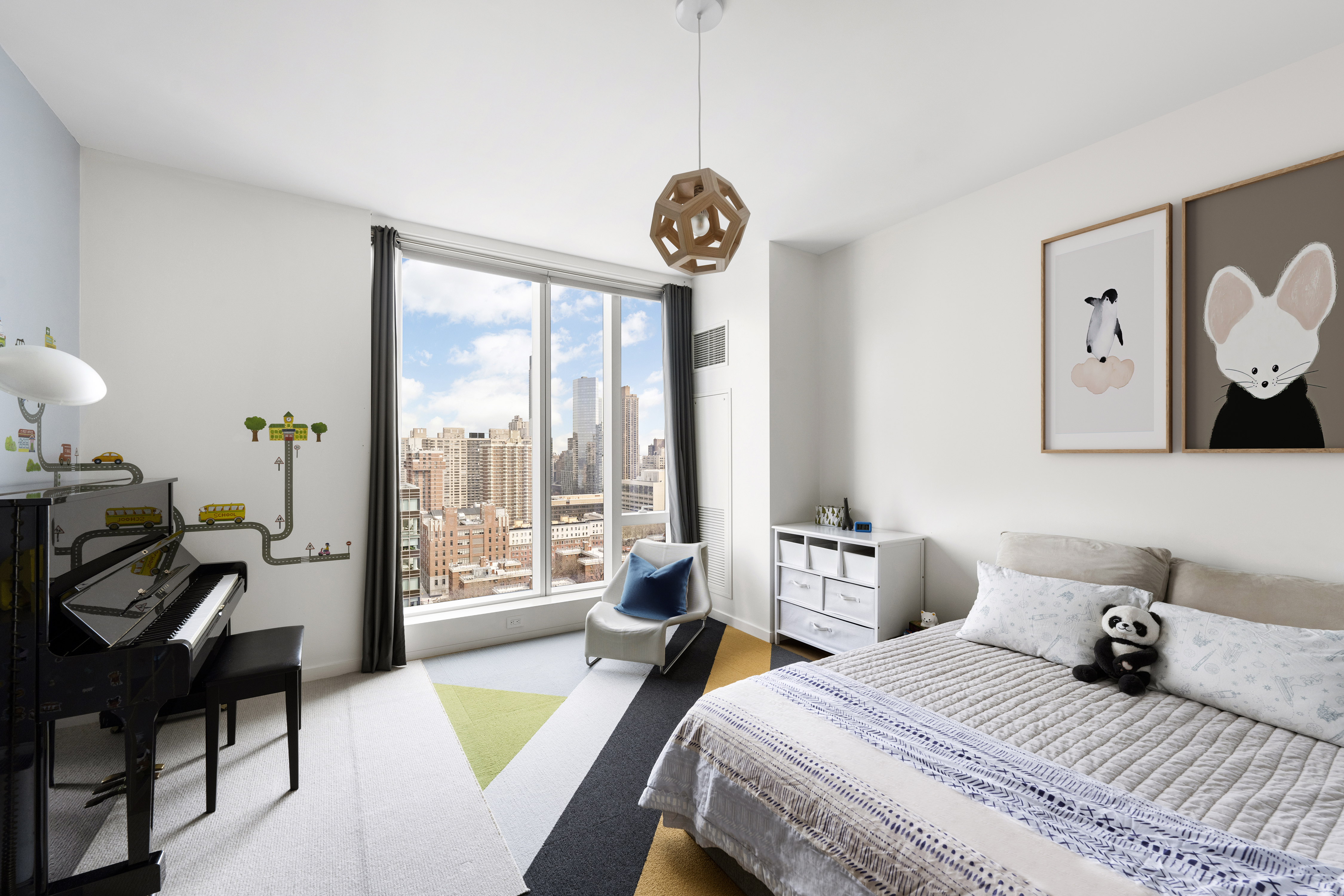 1 West End Avenue, Unit 22C Manhattan, NY 10023 - Photo 10 of 15 a bedroom with two beds and a large window