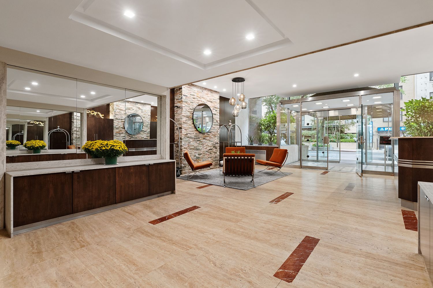 330 East 49th Street, Unit 9C Manhattan, NY 10017 - Photo 11 of 13 a lobby with furniture and a potted plant