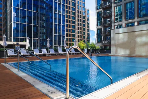 a view of swimming pool with chairs