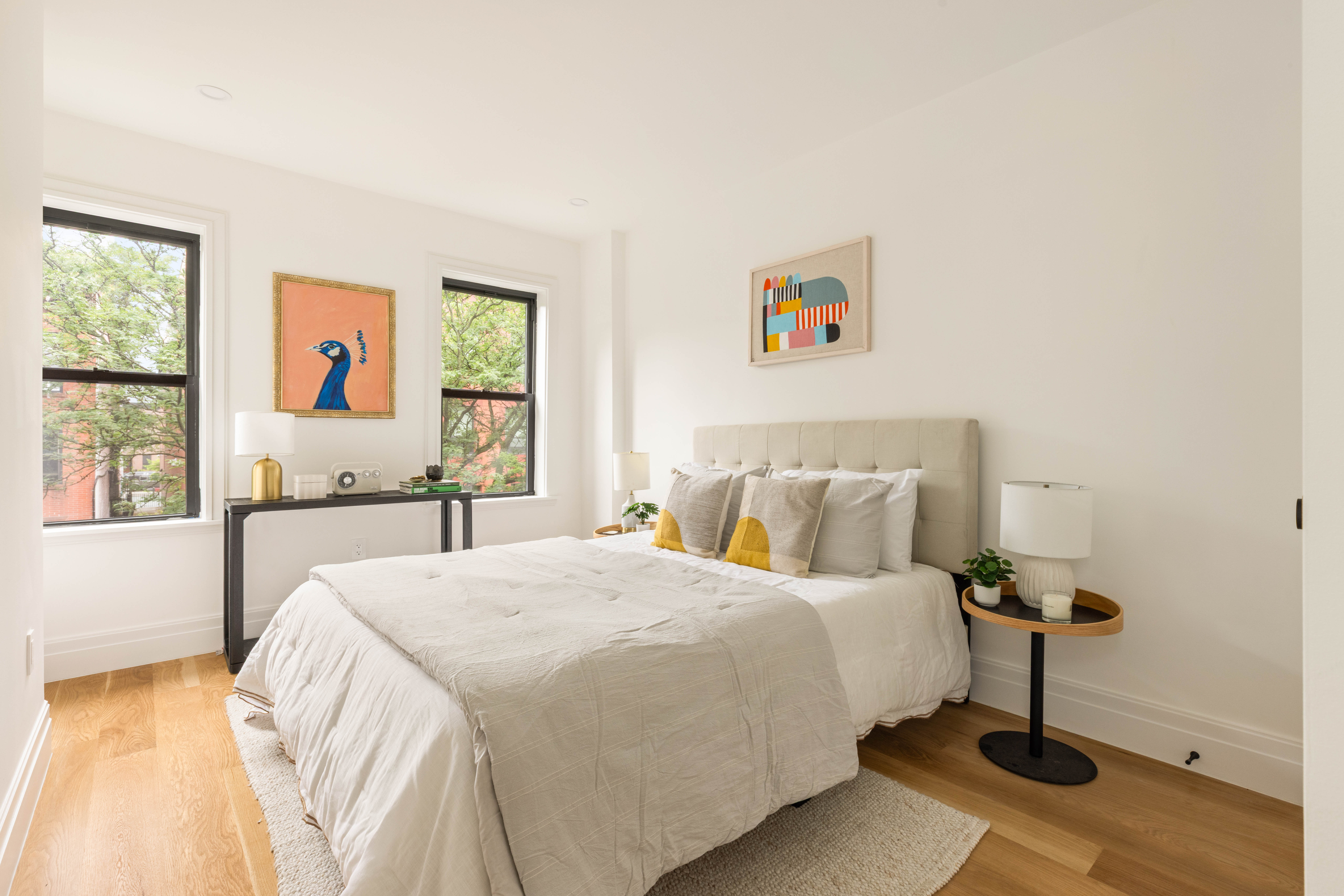 173 8th Street Brooklyn, NY 11215 - Photo 9 of 17 a bedroom with a bed and a window