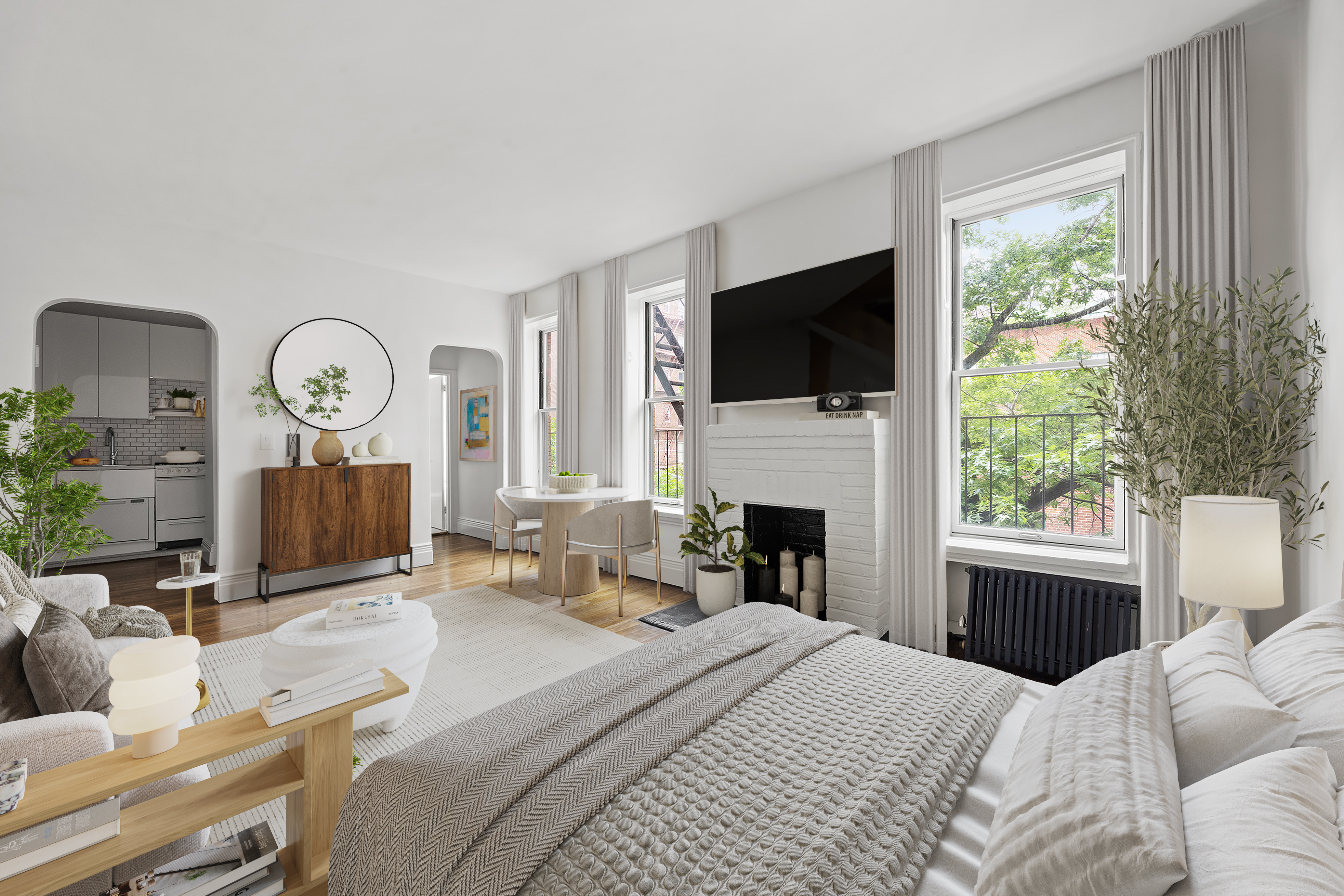 10 Bethune Street, Unit 2B Manhattan, NY 10014 - Photo 3 of 7 a bedroom with a bed a window and a television