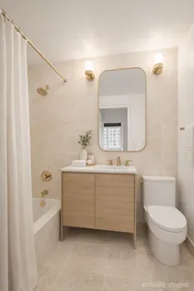 a bathroom with a toilet a sink and bathtub