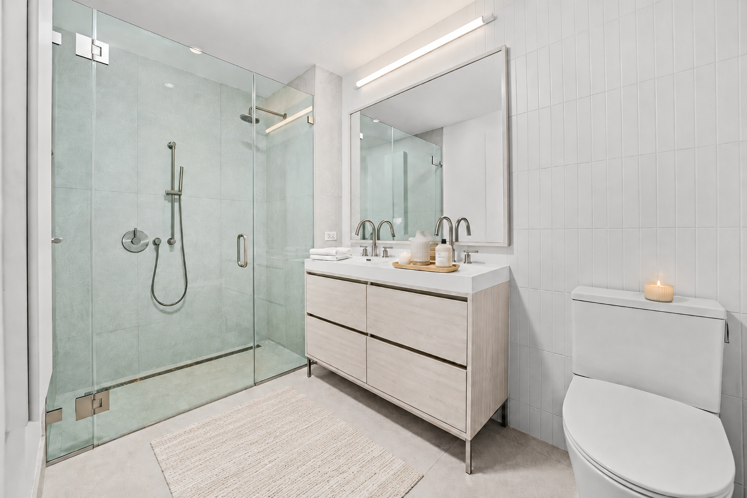 130 2nd Street, Unit 9L Brooklyn, NY 11231 - Photo 6 of 20 a bathroom with a sink a toilet and shower
