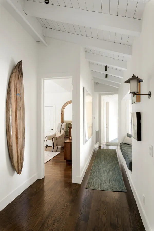 a bedroom with a bed and a couch with window