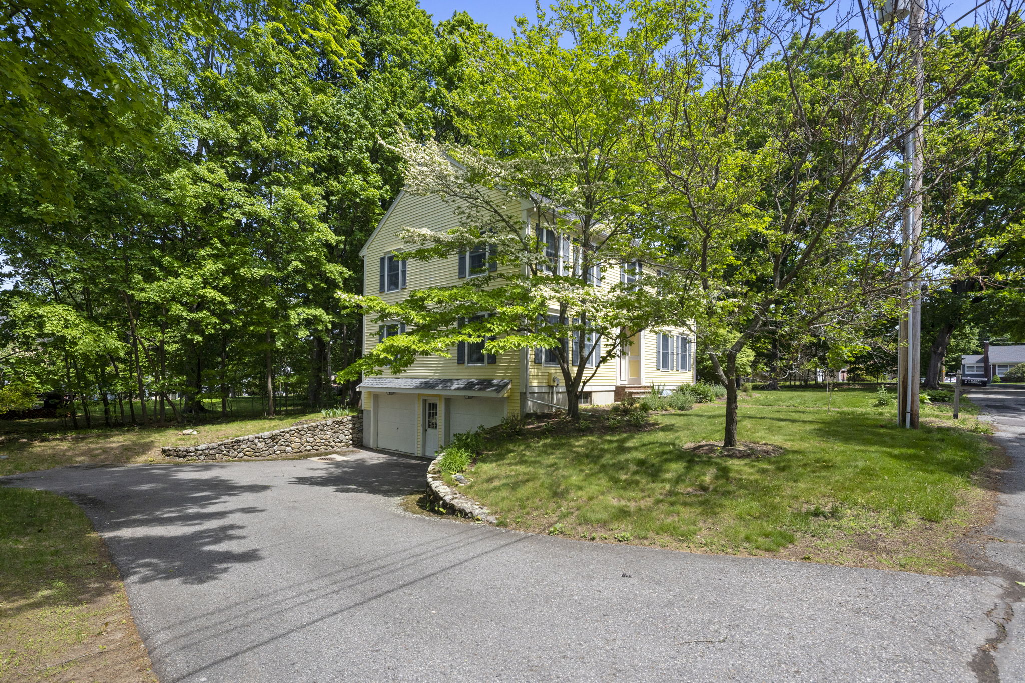2 Laurel Street Lexington, MA 02421 - Photo 42 of 46 a front view of a house with a yard