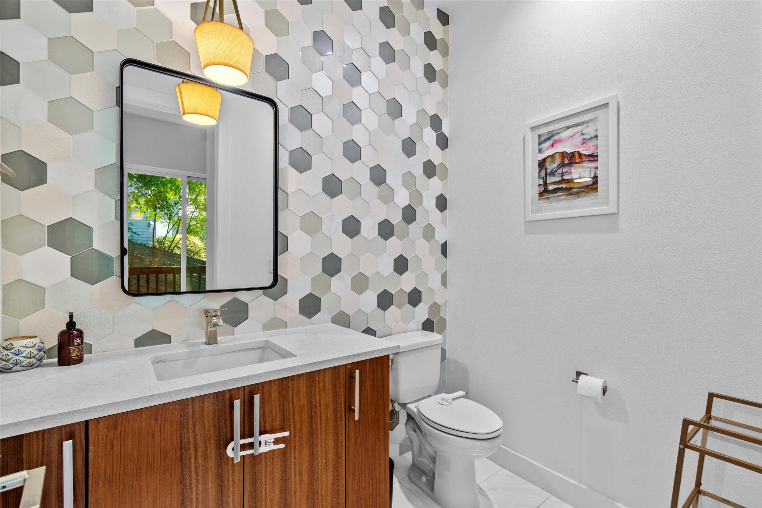 2712 Oak Springs Drive, Unit A Austin, TX 78702 - Photo 17 of 38 a bathroom with a sink and a mirror