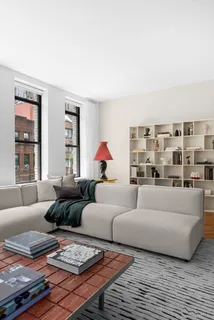 a living room with furniture and a rug