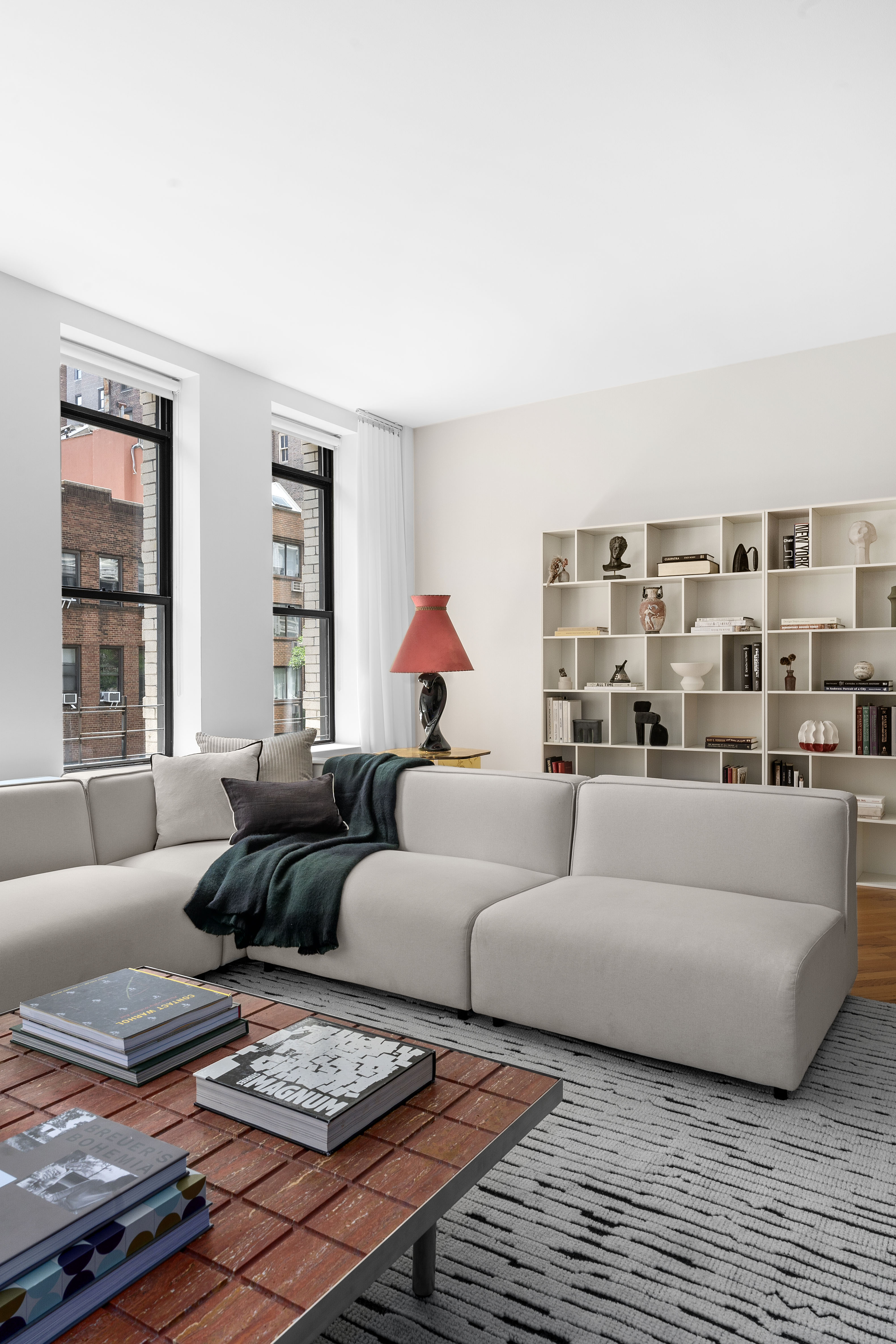 27 East 22nd Street, Unit F4 Manhattan, NY 10010 - Photo 3 of 15 a living room with furniture and a rug