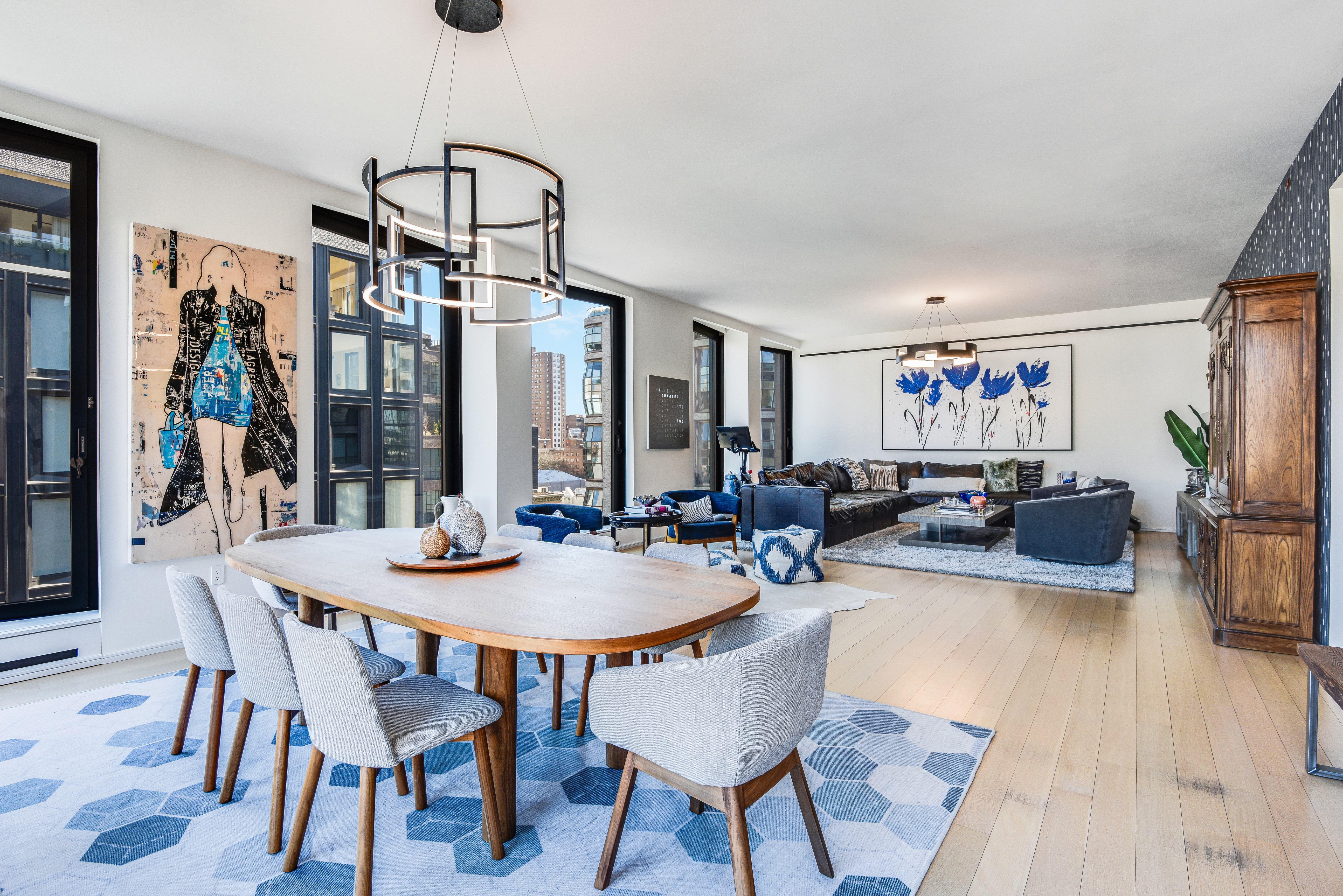 505 West 19th Street, Unit 7W Manhattan, NY 10011 - Photo 4 of 31 a view of a dining room with furniture window and wooden floor