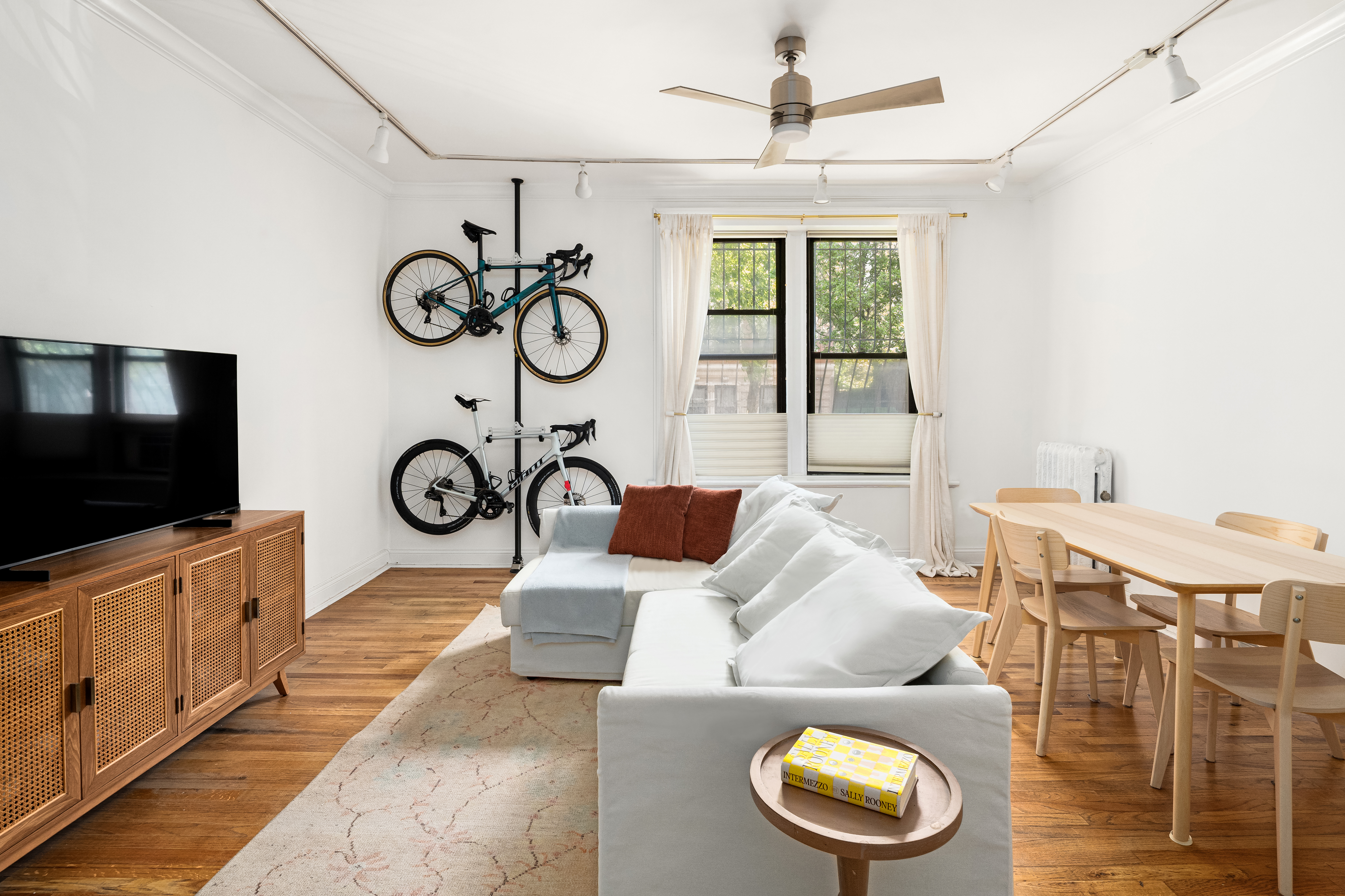 328 Sterling Place, Unit 1A Brooklyn, NY 11238 - Photo 2 of 7 a living room with furniture and a flat screen tv
